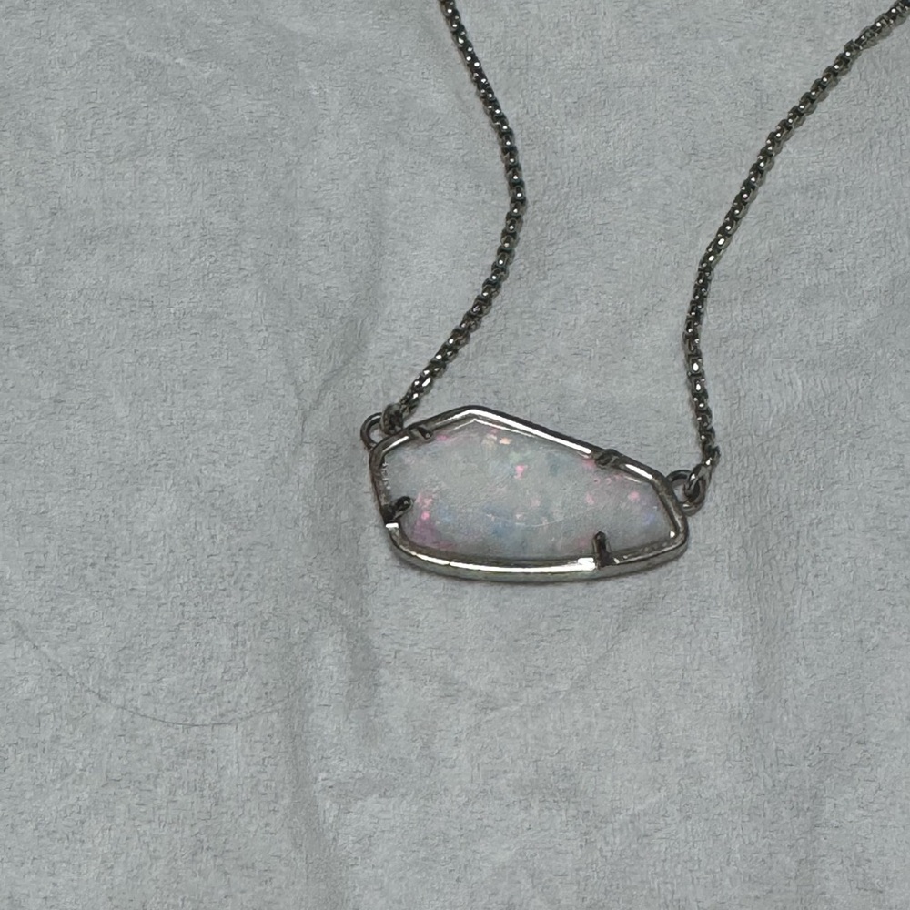 White Kendra Scott necklace. Gold chain.